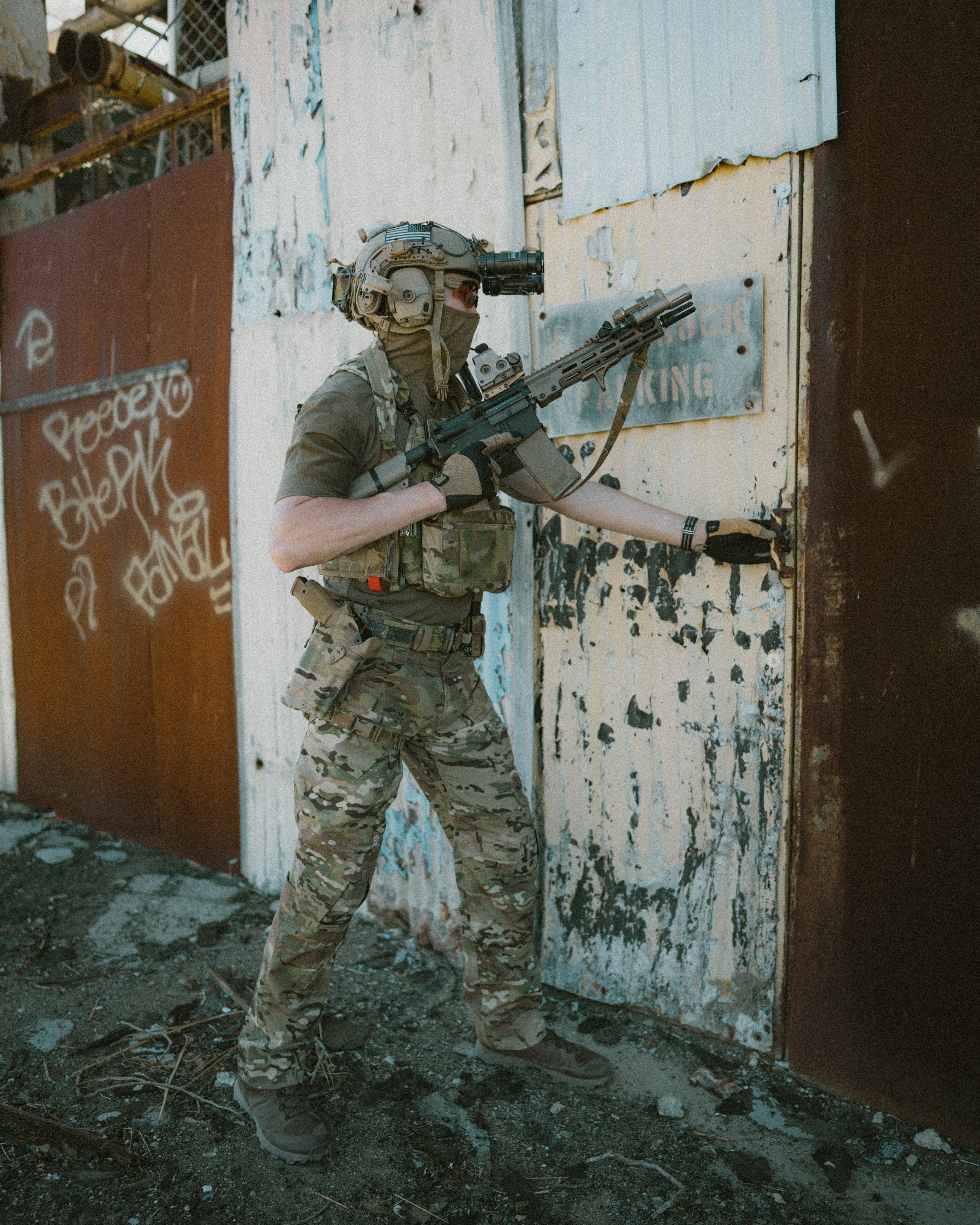 michael is holding a vfc colt licensed URGI aeg replica with HAO mk16 rail, hao 4 prong flash hider, somogear NGAL and other accessories